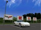 A parked corvette whit a big logo after the car :)